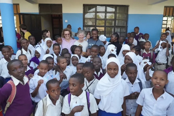 Anne Innis Dagg with school children in Tanzania.